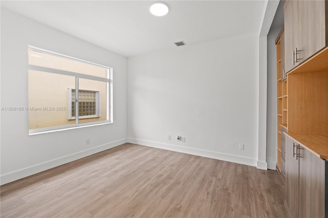11581 SW 10th Ct, Pembroke Pines, FL 33025 - unfurnished room featuring light wood-style floors and baseboards