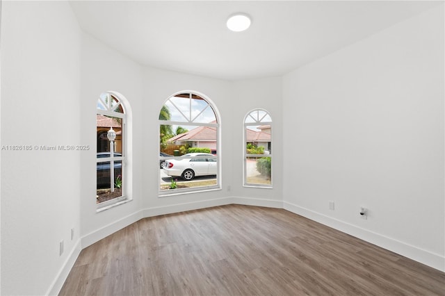 11581 SW 10th Ct, Pembroke Pines, FL 33025 - unfurnished room featuring wood finished floors and baseboards