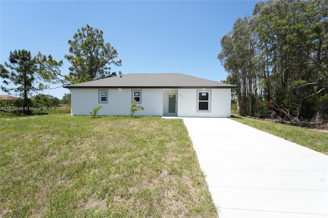 626 Hobart Ave S, Lehigh Acres, FL 33974 - ranch-style house with driveway, a front yard, and stucco siding