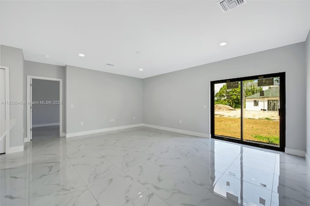 626 Hobart Ave S, Lehigh Acres, FL 33974 - unfurnished room with light marble finish floors and recessed lighting