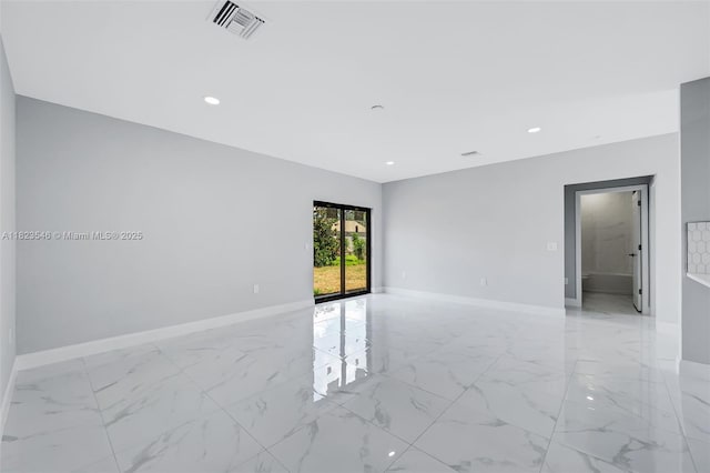 626 Hobart Ave S, Lehigh Acres, FL 33974 - spare room featuring light marble finish flooring and recessed lighting