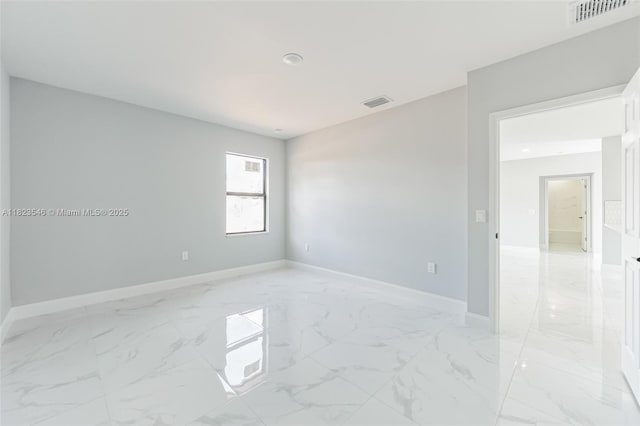 626 Hobart Ave S, Lehigh Acres, FL 33974 - unfurnished room with light marble finish flooring and recessed lighting