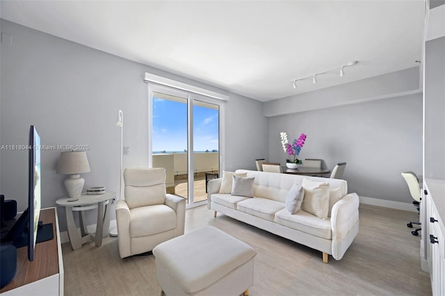 1621 Bay Rd Unit Ph3, Miami Beach, FL 33139 - living area featuring light wood-style floors and track lighting