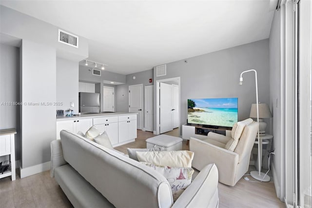 1621 Bay Rd Unit Ph3, Miami Beach, FL 33139 - living room with light wood finished floors