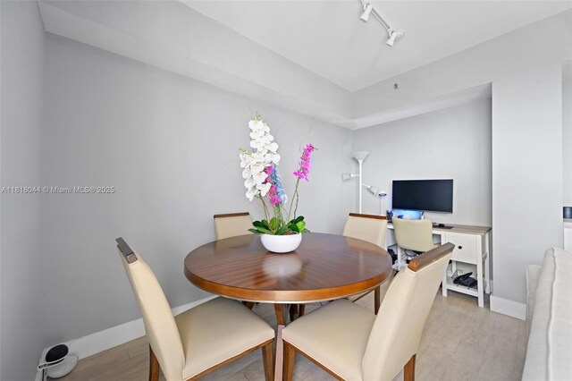 1621 Bay Rd Unit Ph3, Miami Beach, FL 33139 - dining space with light wood-style floors and track lighting