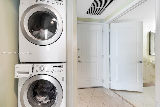 480 NE 30th St Unit 1402, Miami, FL 33137 - washroom with stacked washer / dryer