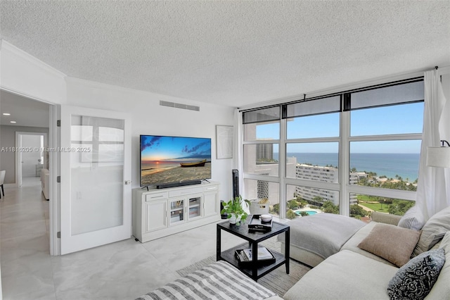 2701 N Ocean Blvd Unit 18A, Fort Lauderdale, FL 33308 - living room featuring a textured ceiling and floor to ceiling windows