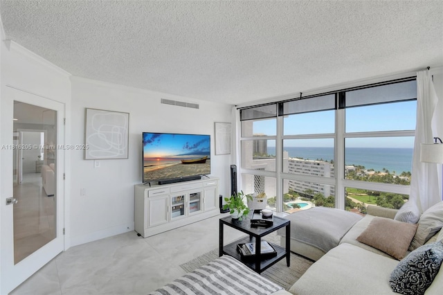 2701 N Ocean Blvd Unit 18A, Fort Lauderdale, FL 33308 - living area with a textured ceiling, floor to ceiling windows, and crown molding