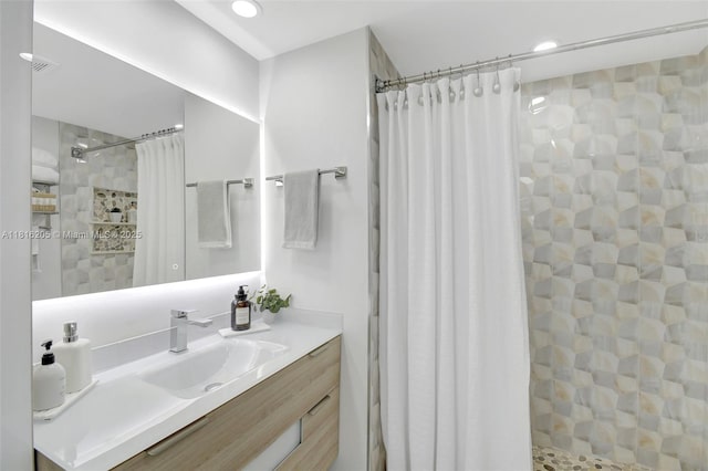 2701 N Ocean Blvd Unit 18A, Fort Lauderdale, FL 33308 - bathroom featuring vanity, a tile shower, and recessed lighting