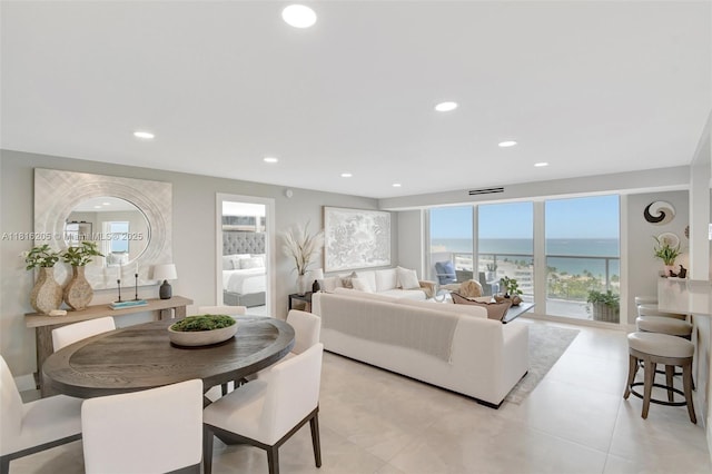 2701 N Ocean Blvd Unit 18A, Fort Lauderdale, FL 33308 - dining space featuring healthy amount of natural light, recessed lighting, light tile patterned floors, and a water view