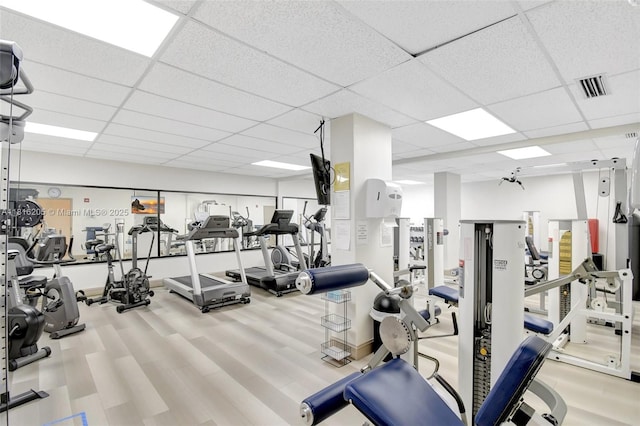 2701 N Ocean Blvd Unit 18A, Fort Lauderdale, FL 33308 - gym featuring a drop ceiling and wood finished floors