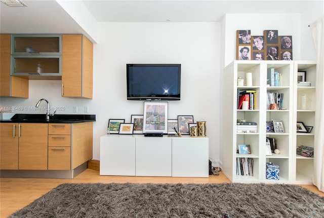 60 SW 13th St Unit 3805, Miami, FL 33130 - kitchen featuring light wood-type flooring and dark countertops