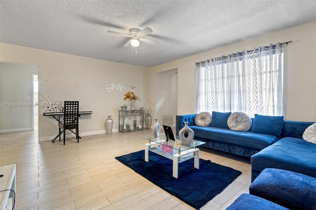 6441 NW 26th St, Sunrise, FL 33313 - living area with ceiling fan, a textured ceiling, and light wood-style floors