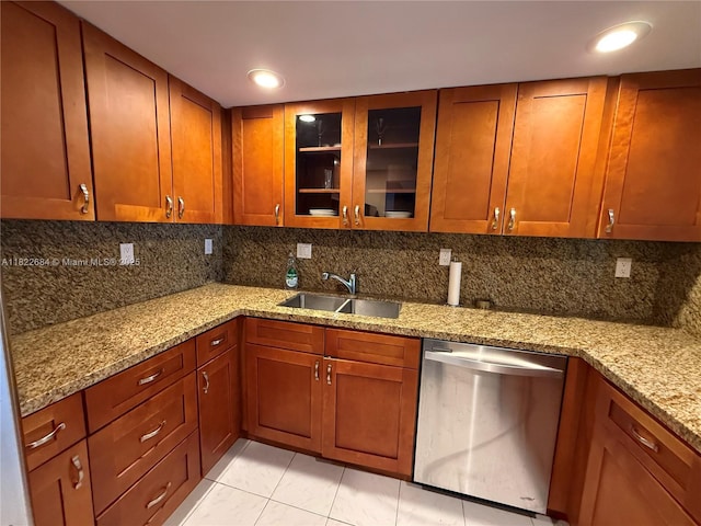 1000 Parkview Dr Unit 905, Hallandale Beach, FL 33009 - kitchen featuring dishwasher, backsplash, light tile patterned floors, and light stone countertops