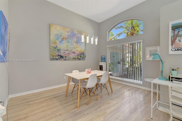 1137 SW Lighthouse Dr, Palm City, FL 34990 - dining space featuring wood finished floors and a high ceiling