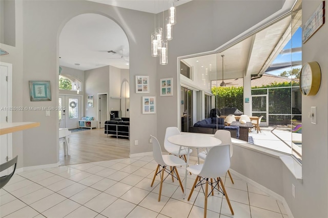 1137 SW Lighthouse Dr, Palm City, FL 34990 - tiled dining area with a high ceiling and arched walkways