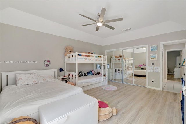 1137 SW Lighthouse Dr, Palm City, FL 34990 - bedroom featuring light wood-style flooring, ceiling fan, and a closet