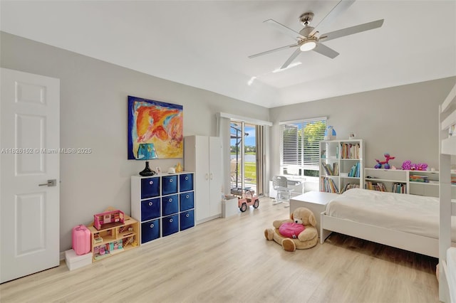 1137 SW Lighthouse Dr, Palm City, FL 34990 - bedroom with wood finished floors, access to outside, a ceiling fan, and lofted ceiling
