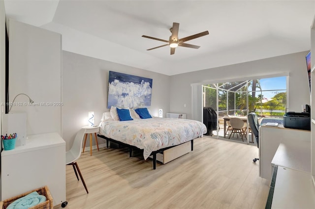 1137 SW Lighthouse Dr, Palm City, FL 34990 - bedroom with light wood-style floors, access to outside, and ceiling fan