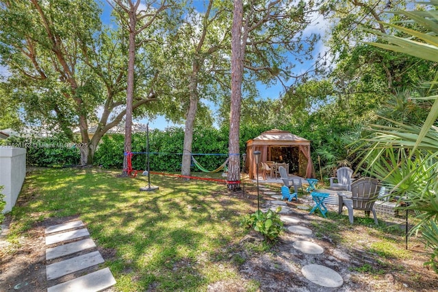 1137 SW Lighthouse Dr, Palm City, FL 34990 - fenced backyard with a gazebo and a patio