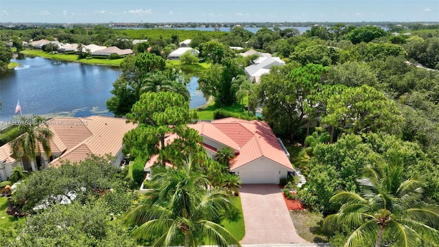 1137 SW Lighthouse Dr, Palm City, FL 34990 - aerial perspective of suburban area featuring a nearby body of water and a tree filled landscape