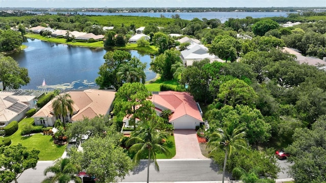 1137 SW Lighthouse Dr, Palm City, FL 34990 - aerial perspective of suburban area with a nearby body of water