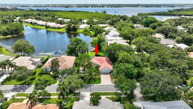 1137 SW Lighthouse Dr, Palm City, FL 34990 - aerial perspective of suburban area with a nearby body of water