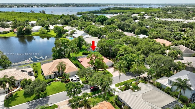 1137 SW Lighthouse Dr, Palm City, FL 34990 - aerial perspective of suburban area with a large body of water