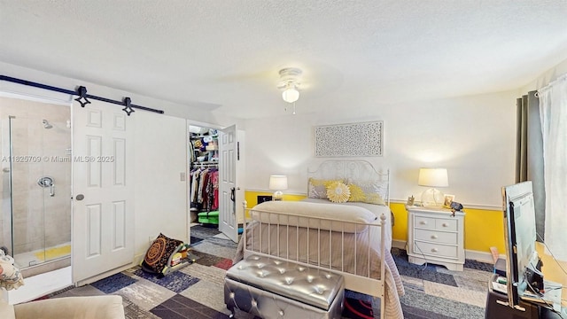 5637 SW 40th St, West Park, FL 33023 - bedroom featuring a spacious closet, a barn door, a closet, and a ceiling fan