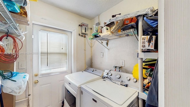5637 SW 40th St, West Park, FL 33023 - laundry area featuring washing machine and dryer and a textured ceiling
