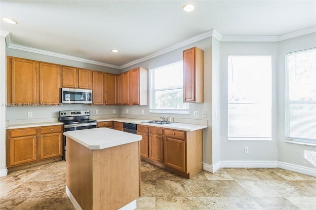 12986 SW 21st St, Miramar, FL 33027 - kitchen featuring stainless steel appliances, light countertops, ornamental molding, brown cabinets, and a kitchen island