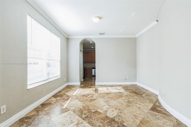 12986 SW 21st St, Miramar, FL 33027 - empty room featuring ornamental molding, arched walkways, and stone tile flooring