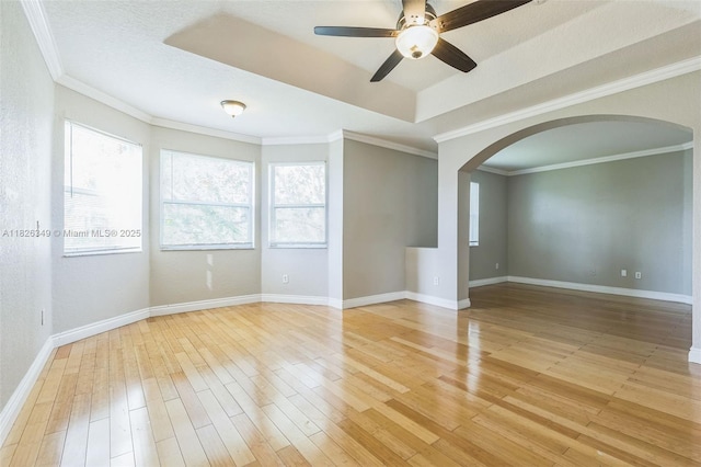 12986 SW 21st St, Miramar, FL 33027 - spare room featuring arched walkways, ceiling fan, light wood-type flooring, and crown molding