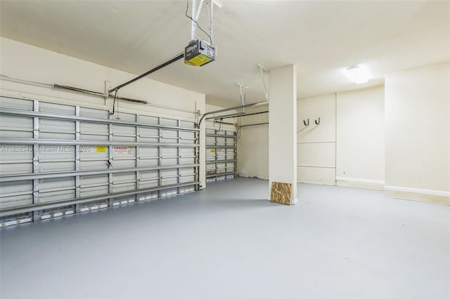 12986 SW 21st St, Miramar, FL 33027 - garage featuring a garage door opener and baseboards