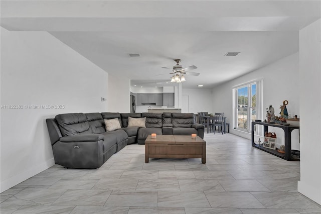 7540 Simms St, Hollywood, FL 33024 - living area featuring a ceiling fan and light marble finish flooring