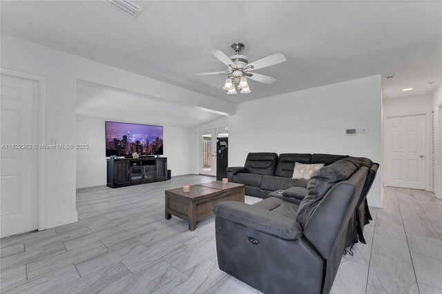 7540 Simms St, Hollywood, FL 33024 - living area featuring a ceiling fan and vaulted ceiling