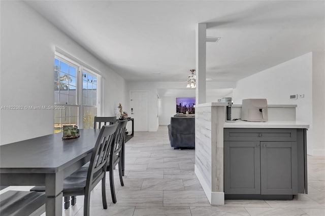 7540 Simms St, Hollywood, FL 33024 - dining space featuring ceiling fan and light marble finish flooring