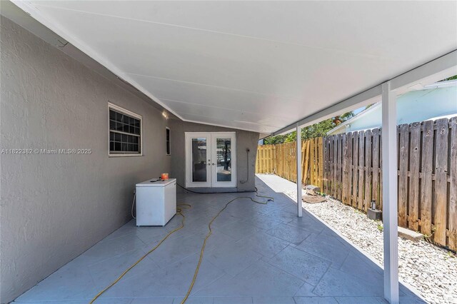 7540 Simms St, Hollywood, FL 33024 - fenced backyard with french doors and a patio