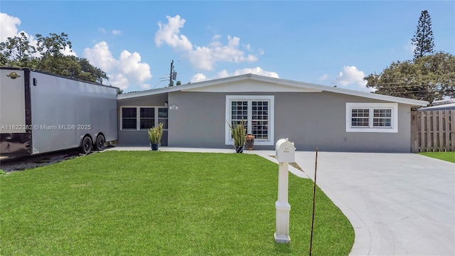 7540 Simms St, Hollywood, FL 33024 - view of front facade with stucco siding and concrete driveway