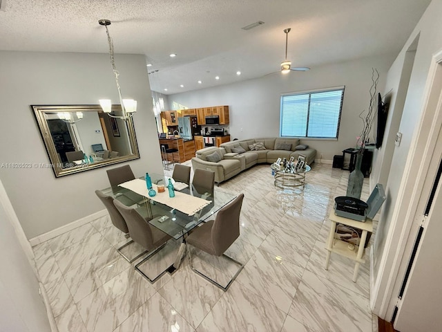 17673 SW 19th St, Miramar, FL 33029 - dining area with light marble finish floors, a ceiling fan, a chandelier, recessed lighting, and a textured ceiling