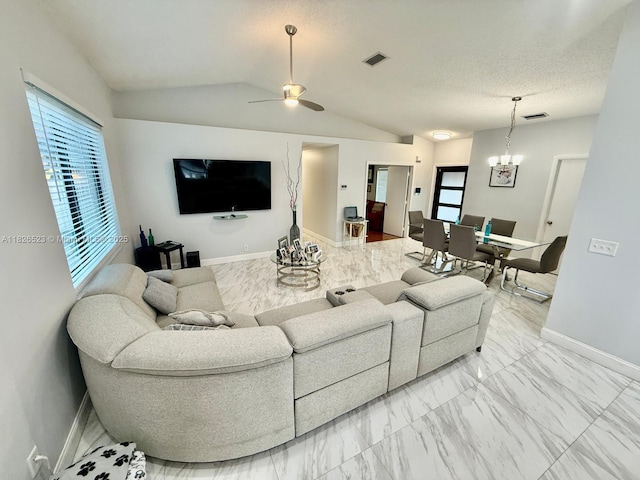 17673 SW 19th St, Miramar, FL 33029 - living room featuring light marble finish flooring, plenty of natural light, lofted ceiling, and a chandelier