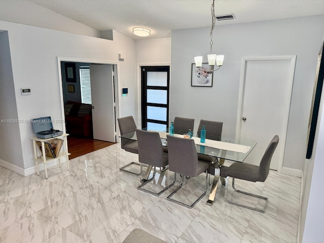 17673 SW 19th St, Miramar, FL 33029 - dining area featuring a chandelier, marble finish flooring, and a textured ceiling