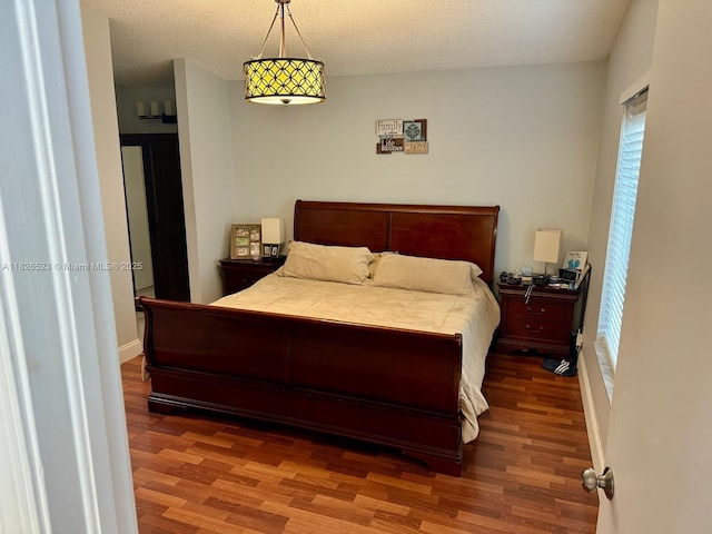 17673 SW 19th St, Miramar, FL 33029 - bedroom with wood finished floors and a textured ceiling