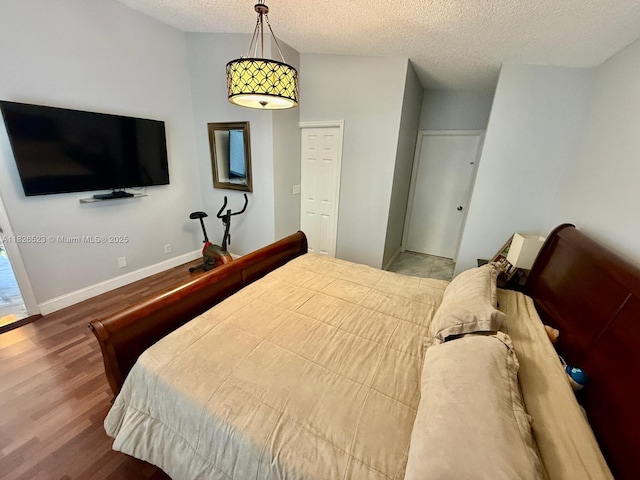 17673 SW 19th St, Miramar, FL 33029 - bedroom featuring wood finished floors and a textured ceiling
