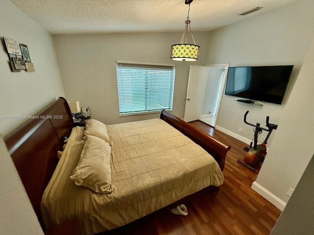 17673 SW 19th St, Miramar, FL 33029 - bedroom with wood finished floors and a textured ceiling