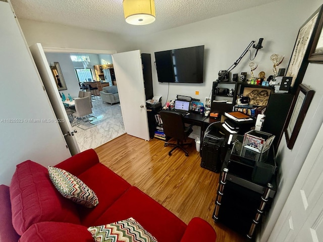 17673 SW 19th St, Miramar, FL 33029 - home office featuring a textured ceiling and wood finished floors