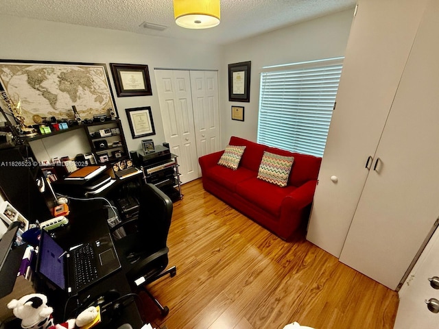 17673 SW 19th St, Miramar, FL 33029 - home office with wood finished floors and a textured ceiling