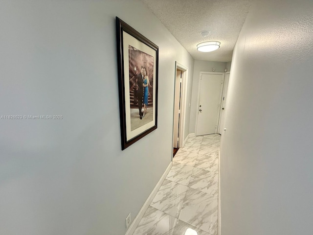 17673 SW 19th St, Miramar, FL 33029 - hallway with light marble finish flooring and a textured ceiling