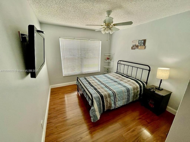 17673 SW 19th St, Miramar, FL 33029 - bedroom featuring a textured ceiling, wood finished floors, and ceiling fan