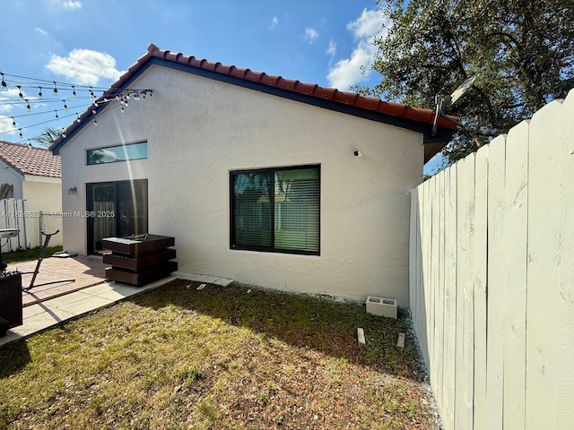 17673 SW 19th St, Miramar, FL 33029 - rear view of property featuring stucco siding, a patio area, and a tile roof